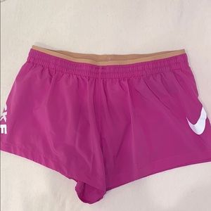 Pink Nike running shorts